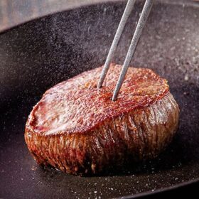 Beef steak fried in pan